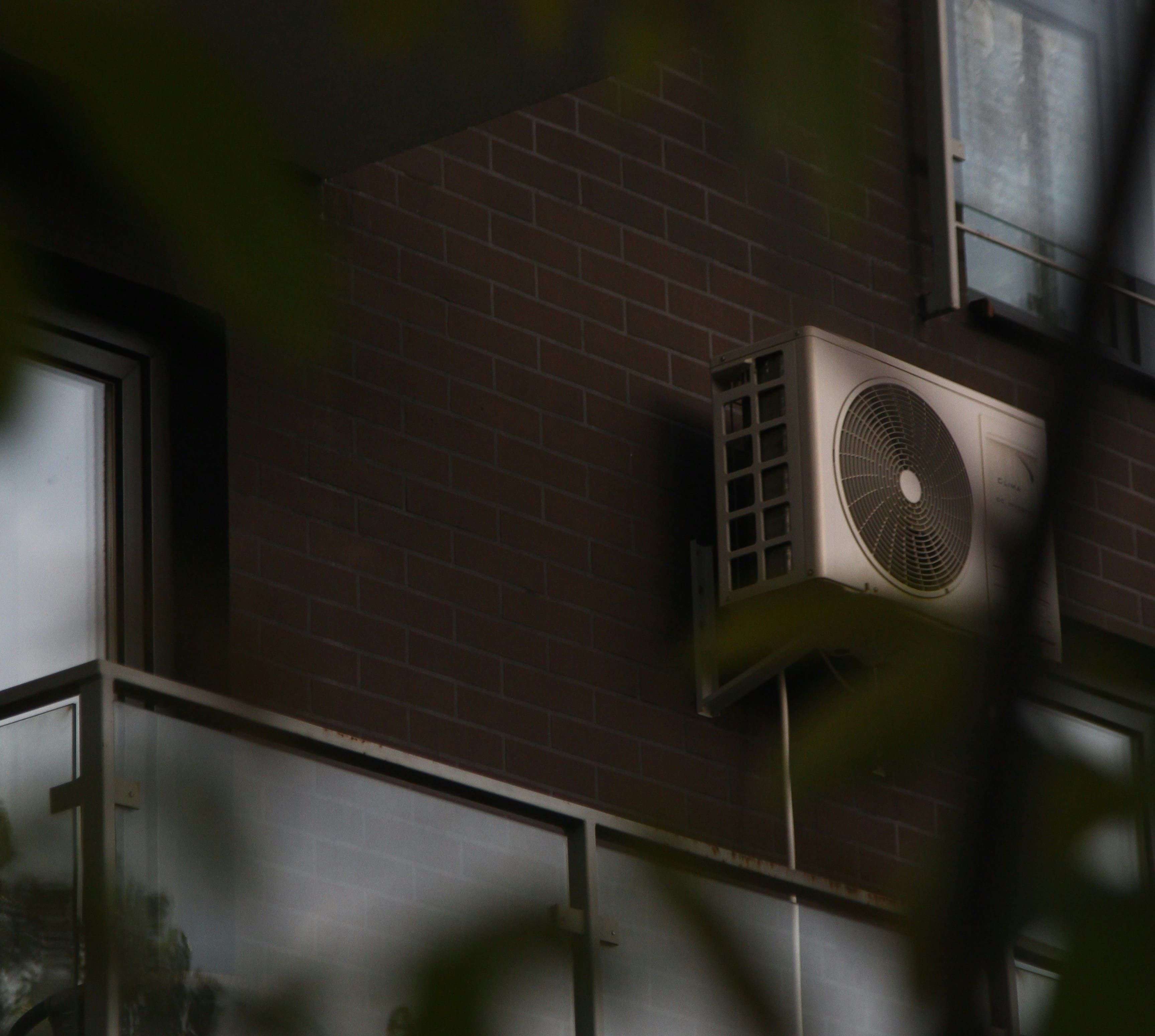 Air conditioning unit on building exterior